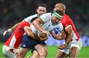 16 September 2023; Rob Herring of Ireland is tackled by William Havili, left, and Afusipa Taumoepeau of Tonga during the 2023 Rugby World Cup Pool B match between Ireland and Tonga at Stade de la Beaujoire in Nantes, France. Photo by Brendan Moran/Sportsfile