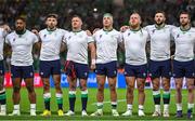 16 September 2023; Ireland players, from left, Bundee Aki, Hugo Keenan, Dave Kilcoyne, Rob Herring, Finlay Bealham, Robbie Henshaw and Mack Hansen during the national anthems before the 2023 Rugby World Cup Pool B match between Ireland and Tonga at Stade de la Beaujoire in Nantes, France. Photo by Brendan Moran/Sportsfile