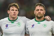 16 September 2023; Ireland players, from left, Ryan Baird and Iain Henderson during the national anthems before the 2023 Rugby World Cup Pool B match between Ireland and Tonga at Stade de la Beaujoire in Nantes, France. Photo by Brendan Moran/Sportsfile