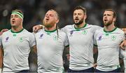 16 September 2023; Ireland players, from left, Rob Herring, Finlay Bealham, Robbie Henshaw and Mack Hansen during the national anthems before the 2023 Rugby World Cup Pool B match between Ireland and Tonga at Stade de la Beaujoire in Nantes, France. Photo by Brendan Moran/Sportsfile