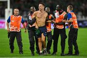 16 September 2023; A pitch invader is detained by security during the 2023 Rugby World Cup Pool B match between Ireland and Tonga at Stade de la Beaujoire in Nantes, France. Photo by Brendan Moran/Sportsfile