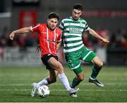 15 September 2023; Adam O'Reilly of Derry City in action against Neil Farrugia of Shamrock Roversduring the SSE Airtricity Men's Premier Division match between Derry City and Shamrock Rovers at The Ryan McBride Brandywell Stadium in Derry. Photo by Stephen McCarthy/Sportsfile