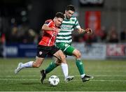 15 September 2023; Adam O'Reilly of Derry City in action against Neil Farrugia of Shamrock Roversduring the SSE Airtricity Men's Premier Division match between Derry City and Shamrock Rovers at The Ryan McBride Brandywell Stadium in Derry. Photo by Stephen McCarthy/Sportsfile