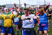 16 September 2023; Players from the Galbally team from Tyrone, wearing masks of well-known GAA personalities, during the 2023 LGFA/Sports Direct Gaelic4Mothers&Others National Blitz Day at Naomh Mearnóg GAA club in Portmarnock, Dublin. Photo by Piaras Ó Mídheach/Sportsfile