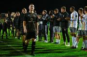18 September 2023; Calvin Douglas of Usher Celtic leads the team to collect their runners up medals after the Leinster Football Senior Cup Final match between Usher Celtic and Bohemians at Dalymount Park in Dublin. Photo by Sam Barnes/Sportsfile