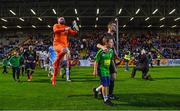 18 September 2023; Usher Celtic captain Leroy Staunton and mascot Jackson O'Doherty, aged 9, lead out their team, followed by Usher Celtic goalkeeper Karl Lynam, before the Leinster Football Senior Cup Final match between Usher Celtic and Bohemians at Dalymount Park in Dublin. Photo by Sam Barnes/Sportsfile