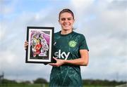 19 September 2023; Ireland Women’s National Team player Jamie Finn with their commemorative collage by SSE Airtricity at the FAI National Training Centre in Abbotstown, Dublin. Photo by Stephen McCarthy/Sportsfile