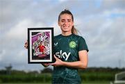 19 September 2023; Ireland Women’s National Team player Chloe Mustaki with their commemorative collage by SSE Airtricity at the FAI National Training Centre in Abbotstown, Dublin. Photo by Stephen McCarthy/Sportsfile