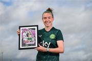 19 September 2023; Ireland Women’s National Team player Claire O'Riordan with their commemorative collage by SSE Airtricity at the FAI National Training Centre in Abbotstown, Dublin. Photo by Stephen McCarthy/Sportsfile
