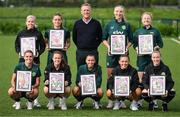 19 September 2023; FAI chief executive officer Jonathan Hill with Ireland Women’s National Team players, back row, from left, Denise O'Sullivan, Chloe Mustaki, Louise Quinn and Amber Barrett, with, front row, Jamie Finn, Heather Payne, Abbie Larkin, Katie McCabe and Claire O'Riordan with their commemorative collages by SSE Airtricity at the FAI National Training Centre in Abbotstown, Dublin. Photo by Stephen McCarthy/Sportsfile