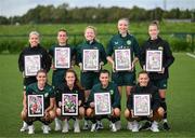 19 September 2023; Ireland Women’s National Team players, back row, from left, Denise O'Sullivan, Chloe Mustaki, Amber Barrett, Louise Quinn, Claire O'Riordan, with, front row, Jamie Finn, Heather Payne, Abbie Larkin and Katie McCabe with their commemorative collages by SSE Airtricity at the FAI National Training Centre in Abbotstown, Dublin. Photo by Stephen McCarthy/Sportsfile