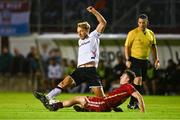 15 September 2023; Greg Sloggett of Dundalk is tackled by Ed McCarthy of Galway United during the Sports Direct Men’s FAI Cup quarter-final match between Galway United and Dundalk at Eamonn Deacy Park in Galway. Photo by Ben McShane/Sportsfile