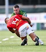 22 September 2023; Andrew Smith of Connacht is tackled by Shay McCarthy of Munster during the pre season friendly match between Connacht and Munster at The Sportsground in Galway. Photo by Ben McShane/Sportsfile