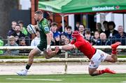 22 September 2023; Diarmuid Kilgallen of Connacht evades the tackle of John Hodnett of Munster on his way to scoring his side's first try during the pre season friendly match between Connacht and Munster at The Sportsground in Galway. Photo by Ben McShane/Sportsfile