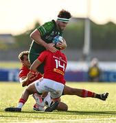 22 September 2023; Tom Daly of Connacht is tackled by Antoine Frische, left, and Shay McCarthy of Munster during the pre season friendly match between Connacht and Munster at The Sportsground in Galway. Photo by Ben McShane/Sportsfile