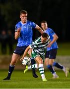 22 September 2023; Liam Burt of Shamrock Rovers in action against Jack Keaney of UCD during the SSE Airtricity Men's Premier Division match between UCD and Shamrock Rovers at UCD Bowl in Dublin. Photo by Stephen McCarthy/Sportsfile