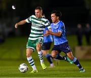 22 September 2023; Liam Burt of Shamrock Rovers in action against Sean Brennan of UCD during the SSE Airtricity Men's Premier Division match between UCD and Shamrock Rovers at UCD Bowl in Dublin. Photo by Stephen McCarthy/Sportsfile
