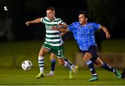 22 September 2023; Liam Burt of Shamrock Rovers in action against Sean Brennan of UCD during the SSE Airtricity Men's Premier Division match between UCD and Shamrock Rovers at UCD Bowl in Dublin. Photo by Stephen McCarthy/Sportsfile