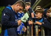 22 September 2023; Ben Brownlee of Leinster signs an autograph for a young supporter after the pre season friendly match between Leinster and Ulster at Navan RFC in Navan, Meath. Photo by Sam Barnes/Sportsfile