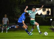 22 September 2023; Aaron Greene of Shamrock Rovers is tackled by Sean Brennan of UCD during the SSE Airtricity Men's Premier Division match between UCD and Shamrock Rovers at UCD Bowl in Dublin. Photo by Stephen McCarthy/Sportsfile