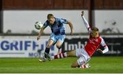 22 September 2023; Daryl Horgan of Dundalk is tackled by Jamie Lennon of St Patrick's Athletic during the SSE Airtricity Men's Premier Division match between St Patrick's Athletic and Dundalk at Richmond Park in Dublin. Photo by Seb Daly/Sportsfile