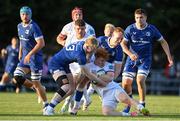 22 September 2023; Rory Telfer of Ulster is tackled by Jamie Osborne, left, and Ciarán Frawley of Leinster during the pre season friendly match between Leinster and Ulster at Navan RFC in Navan, Meath. Photo by Sam Barnes/Sportsfile