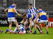 23 September 2023; Michael Darragh MacAuley of Ballyboden St Enda's in action against Castleknock players, from left, Cian Boyle, Rob Shaw and Eoin O'Brien during the Dublin Senior Football Championship quarter-final match between Ballyboden St Enda's and Castleknock at Parnell Park in Dublin. Photo by Piaras Ó Mídheach/Sportsfile