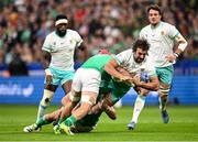 23 September 2023; Eben Etzebeth of South Africa is tackled by Josh van der Flier, left, and Rónan Kelleher during the 2023 Rugby World Cup Pool B match between South Africa and Ireland at Stade de France in Paris, France. Photo by Ramsey Cardy/Sportsfile