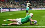23 September 2023; Mack Hansen of Ireland dives over to score his side's first try during the 2023 Rugby World Cup Pool B match between South Africa and Ireland at Stade de France in Paris, France. Photo by Harry Murphy/Sportsfile