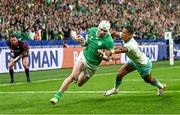 23 September 2023; Mack Hansen of Ireland dives over to score his side's first try despite the efforts of Manie Libbok of South Africa during the 2023 Rugby World Cup Pool B match between South Africa and Ireland at Stade de France in Paris, France. Photo by Harry Murphy/Sportsfile