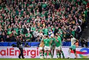 23 September 2023; Mack Hansen of Ireland, centre, celebrates with team-mates after scoring his side's first try during the 2023 Rugby World Cup Pool B match between South Africa and Ireland at Stade de France in Paris, France. Photo by Ramsey Cardy/Sportsfile