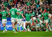 23 September 2023; Ireland players Bundee Aki and Josh van der Flier of Ireland, red scrum cap, lead the celebrations after winning the 2023 Rugby World Cup Pool B match between South Africa and Ireland at Stade de France in Paris, France. Photo by Brendan Moran/Sportsfile