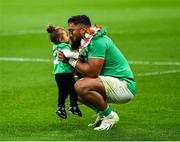 23 September 2023; Bundee Aki of Ireland celebrates with his youngest child Ailbhe Lasela Ali'itasi Aki after the 2023 Rugby World Cup Pool B match between South Africa and Ireland at Stade de France in Paris, France. Photo by Brendan Moran/Sportsfile