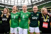 23 September 2023; Republic of Ireland players and staff, from left, equipment manager Orla Haran, Kyra Carusa, Megan Connolly, Claire O'Riordan and operations manager Evelyn McMullan after the UEFA Women's Nations League B1 match between Republic of Ireland and Northern Ireland at Aviva Stadium in Dublin. Photo by Stephen McCarthy/Sportsfile