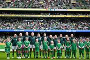 23 September 2023; Republic of Ireland players, from left, Katie McCabe, goalkeeper Courtney Brosnan, Louise Quinn, Caitlin Hayes, Megan Connolly, Diane Caldwell, Tyler Toland, Denise O'Sullivan, Heather Payne, Lucy Quinn and Kyra Carusa stand for the playing of the National Anthem before the UEFA Women's Nations League B1 match between Republic of Ireland and Northern Ireland at Aviva Stadium in Dublin. Photo by Stephen McCarthy/Sportsfile