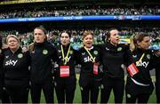 23 September 2023; Republic of Ireland staff, from left, operations manager Evelyn McMullan, masseuse Hannah Tobin Jones, physiotherapist Susie Coffey, Dr Siobhan Forman, team doctor; physiotherapist Angela Kenneally and performance coach Ivi Casagrande stand for the playing of the National Anthem before the UEFA Women's Nations League B1 match between Republic of Ireland and Northern Ireland at Aviva Stadium in Dublin. Photo by Stephen McCarthy/Sportsfile