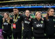 23 September 2023; Republic of Ireland staff, from left, equipment manager Orla Haran, Derek McDonnell, operations; social media coordinator Emma Clinton, operations manager Evelyn McMullan and masseuse Hannah Tobin Jones stand for the playing of the National Anthem before the UEFA Women's Nations League B1 match between Republic of Ireland and Northern Ireland at Aviva Stadium in Dublin. Photo by Stephen McCarthy/Sportsfile