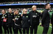 23 September 2023; Republic of Ireland staff, from left, Dr Siobhan Forman, team doctor; physiotherapist Angela Kenneally, performance coach Ivi Casagrande, STATSports analyst Claire Dunne, assistant coach Emma Byrne and goalkeeping coach Richie Fitzgibbon stand for the playing of the National Anthem before the UEFA Women's Nations League B1 match between Republic of Ireland and Northern Ireland at Aviva Stadium in Dublin. Photo by Stephen McCarthy/Sportsfile