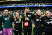 23 September 2023; Republic of Ireland goalkeeper Megan Walsh with staff, from left, equipment manager Orla Haran, Derek McDonnell, operations; social media coordinator Emma Clinton and operations manager Evelyn McMullan stand for the playing of the National Anthem before the UEFA Women's Nations League B1 match between Republic of Ireland and Northern Ireland at Aviva Stadium in Dublin. Photo by Stephen McCarthy/Sportsfile