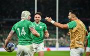 23 September 2023; Mack Hansen of Ireland celebrates with teammates Conor Murray and Hugo Keenan after scoring his side's first try during the 2023 Rugby World Cup Pool B match between South Africa and Ireland at Stade de France in Paris, France. Photo by Harry Murphy/Sportsfile