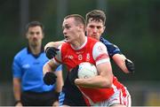 24 September 2023; Peadar O'Cofaigh Byrne of Cuala in action against Cormac McCartan of St Judes during the Dublin Senior Football Championship quarter-final match between St Judes and Cuala at Parnell Park in Dublin. Photo by Tyler Miller/Sportsfile