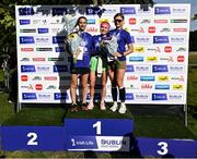 23 September 2023; Women's winner Aoife Cleary, from Wicklow, centre, with second place Fiona Stack, Raheny AC, left, and third place Yuliya Tarasova, Clonliffe Harriers AC, on the podium after the 2023 Irish Life Dublin Half Marathon which took place on Saturday 23rd of September at Phoenix Park in Dublin. Photo by David Fitzgerald/Sportsfile