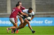 24 September 2023; Josh Kelly of St Vincents is tackled by Rutherson Real of Raheny, left, and Cian Ivers during the Dublin Senior Football Championship quarter-final match between Raheny and St Vincents at Parnell Park in Dublin. Photo by Tyler Miller/Sportsfile
