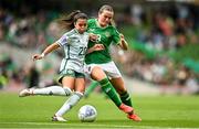 23 September 2023; Joely Andrews of Northern Ireland in action against Tyler Toland of Republic of Ireland during the UEFA Women's Nations League B1 match between Republic of Ireland and Northern Ireland at Aviva Stadium in Dublin. Photo by Eóin Noonan/Sportsfile