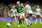 23 September 2023; Denise O'Sullivan of Republic of Ireland in action against Joely Andrews of Northern Ireland during the UEFA Women's Nations League B1 match between Republic of Ireland and Northern Ireland at Aviva Stadium in Dublin. Photo by Eóin Noonan/Sportsfile