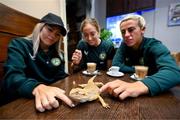 25 September 2023; Republic of Ireland players, from left, Denise O'Sullivan, Megan Connolly and Savannah McCarthy with a bearded dragon at Zoo Café in Budapest, Hungary, during some down time ahead of their UEFA Women's Nations League B1 match against Hungary, on Tuesday. Photo by Stephen McCarthy/Sportsfile