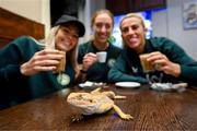 25 September 2023; Republic of Ireland players, from left, Denise O'Sullivan, Megan Connolly and Savannah McCarthy with a bearded dragon at Zoo Café in Budapest, Hungary, during some down time ahead of their UEFA Women's Nations League B1 match against Hungary, on Tuesday. Photo by Stephen McCarthy/Sportsfile