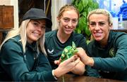 25 September 2023; Republic of Ireland players, from left, Denise O'Sullivan, Megan Connolly and Savannah McCarthy with Flash, a chameleon, at Zoo Café in Budapest, Hungary, during some down time ahead of their UEFA Women's Nations League B1 match against Hungary, on Tuesday. Photo by Stephen McCarthy/Sportsfile