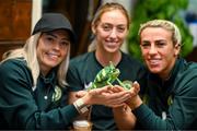 25 September 2023; Republic of Ireland players, from left, Denise O'Sullivan, Megan Connolly and Savannah McCarthy with Flash, a chameleon, at Zoo Café in Budapest, Hungary, during some down time ahead of their UEFA Women's Nations League B1 match against Hungary, on Tuesday. Photo by Stephen McCarthy/Sportsfile
