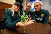 25 September 2023; Republic of Ireland players, from left, Denise O'Sullivan, Megan Connolly and Savannah McCarthy with Flash, a chameleon, at Zoo Café in Budapest, Hungary, during some down time ahead of their UEFA Women's Nations League B1 match against Hungary, on Tuesday. Photo by Stephen McCarthy/Sportsfile